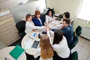 Romanian language B1 about job with Young business people group of bank workers have meeting and working in modern office