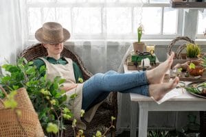 learning Romanian definite article by a girl who sits on the veranda and article plant