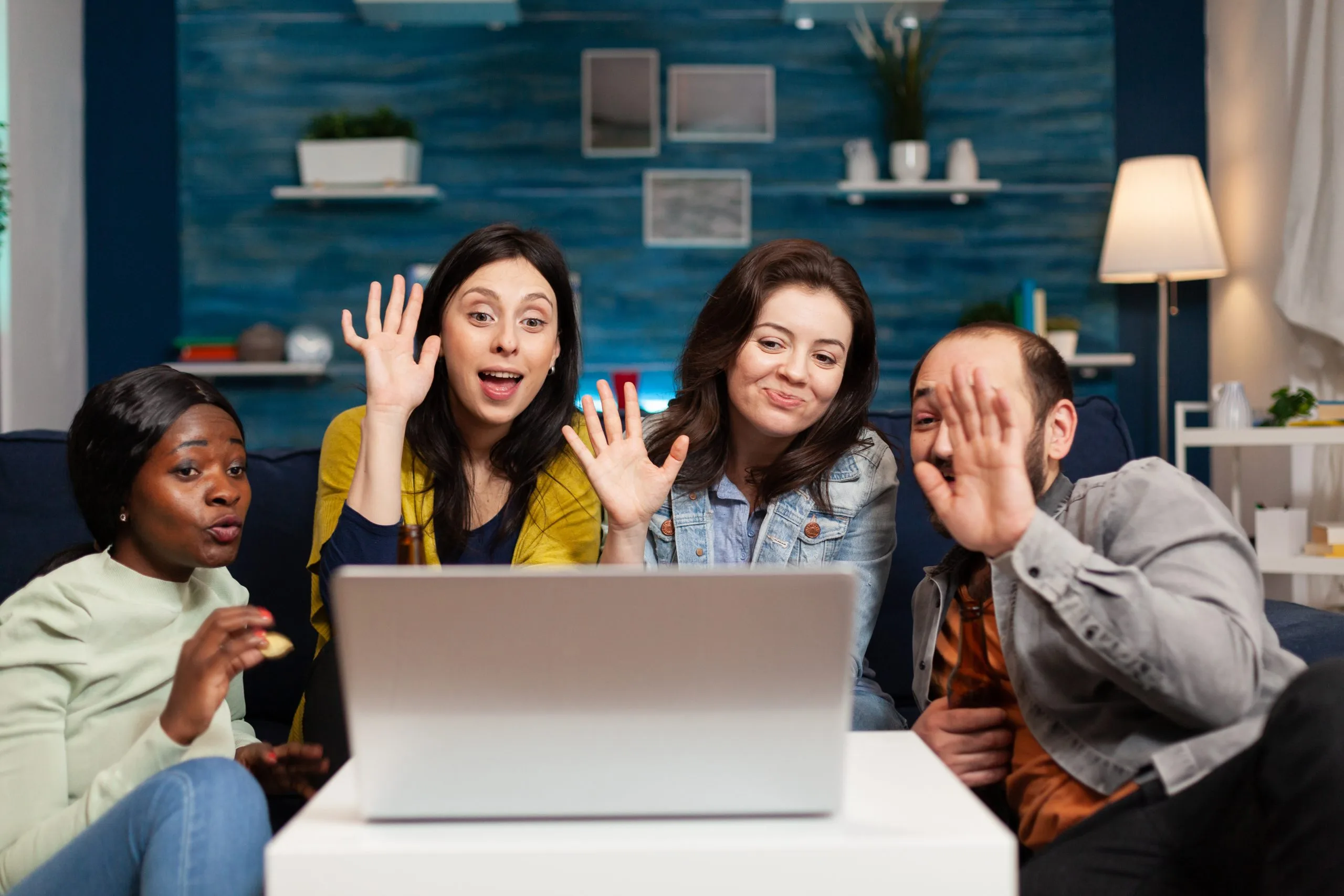 Happy multi-ethnic friends greeting her collegue during online Romanian Language Group Classes